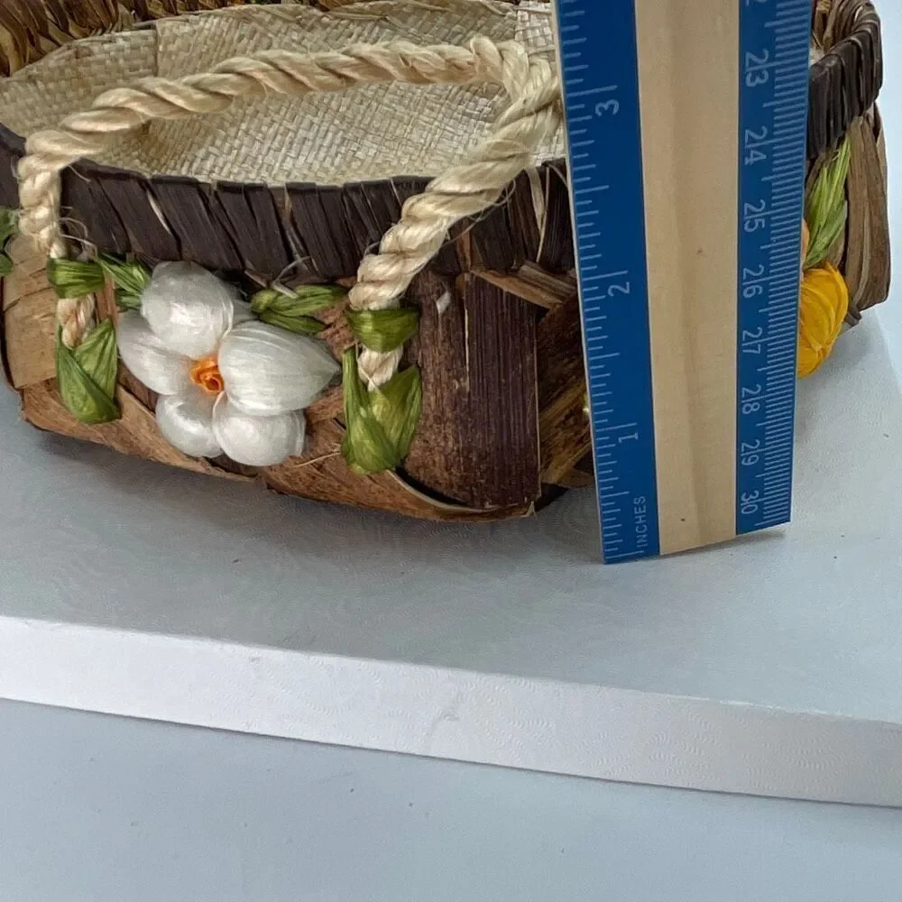 Vintage woven raffia basket with flowers and handles. Lined.